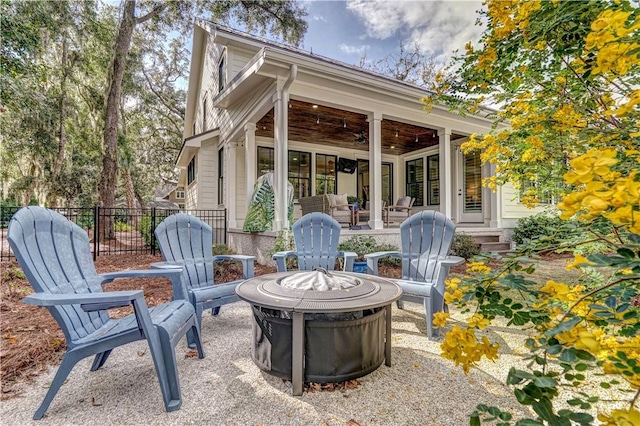 view of patio / terrace featuring an outdoor fire pit