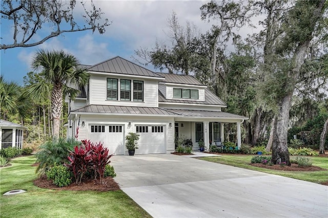 view of front facade with a garage and a front yard