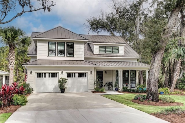 view of front facade featuring a garage and covered porch