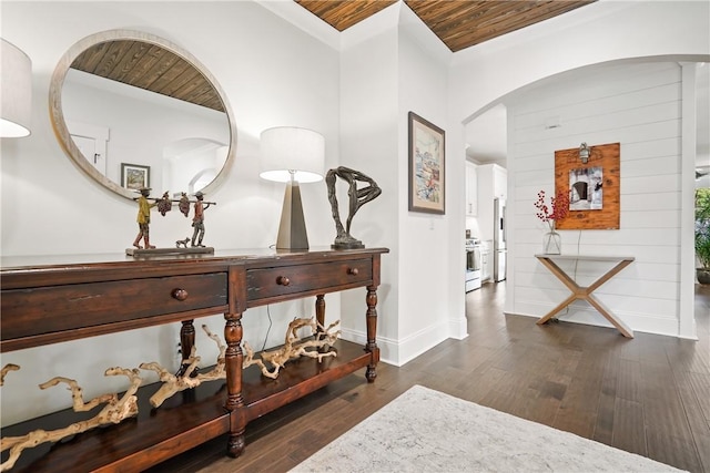 hallway featuring dark hardwood / wood-style flooring and wood ceiling