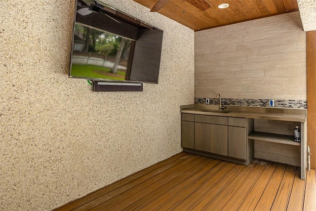 bathroom with wood-type flooring, vanity, ceiling fan, and wood ceiling