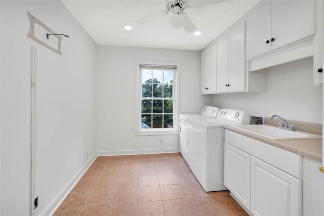 washroom with ceiling fan, sink, cabinets, washer and clothes dryer, and light tile patterned floors