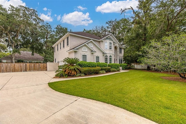 view of property featuring a front yard