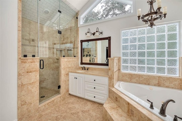 bathroom featuring tile patterned flooring, a chandelier, vaulted ceiling, vanity, and independent shower and bath