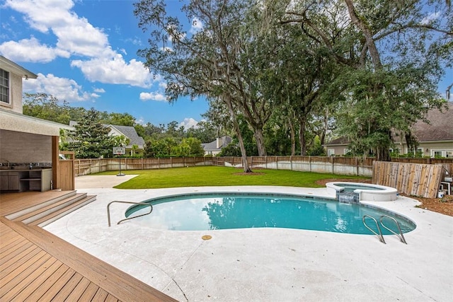 view of swimming pool featuring a lawn, an in ground hot tub, and a deck