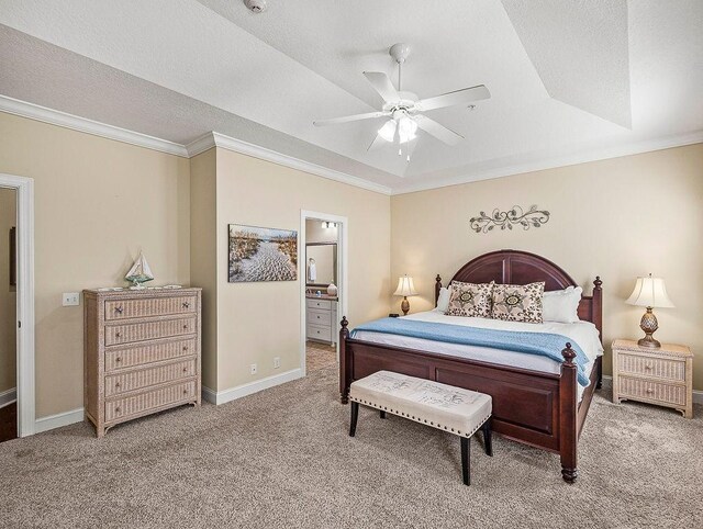 carpeted bedroom with ensuite bathroom, ceiling fan, ornamental molding, and a textured ceiling