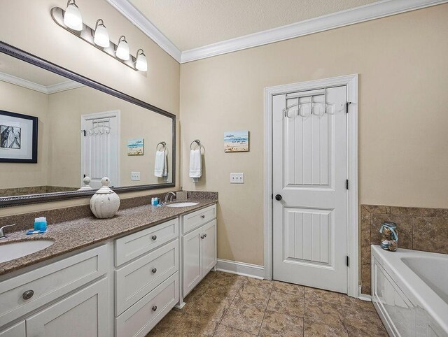 bathroom with a bathing tub, crown molding, and vanity