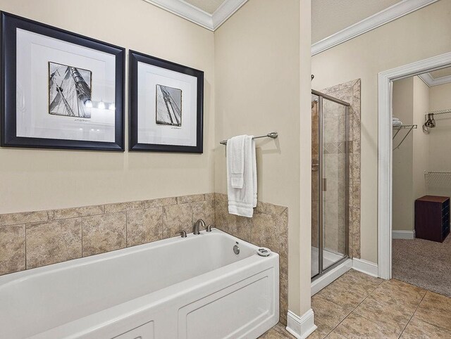 bathroom featuring separate shower and tub, tile patterned floors, and crown molding