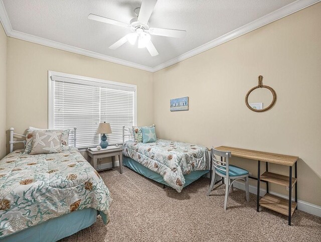 carpeted bedroom featuring ceiling fan and crown molding