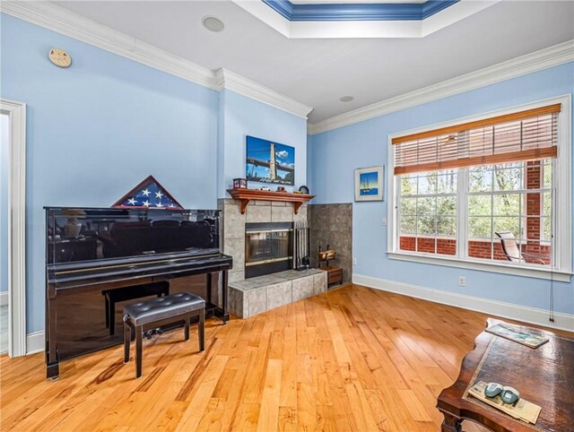 bedroom featuring ornamental molding, light carpet, and baseboards