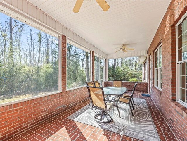 view of front of property with brick siding, a chimney, a shingled roof, an attached garage, and driveway