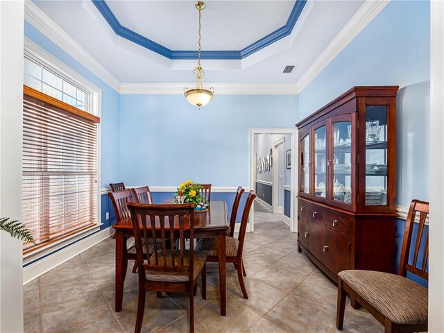 kitchen with hanging light fixtures, island range hood, a sink, and built in appliances