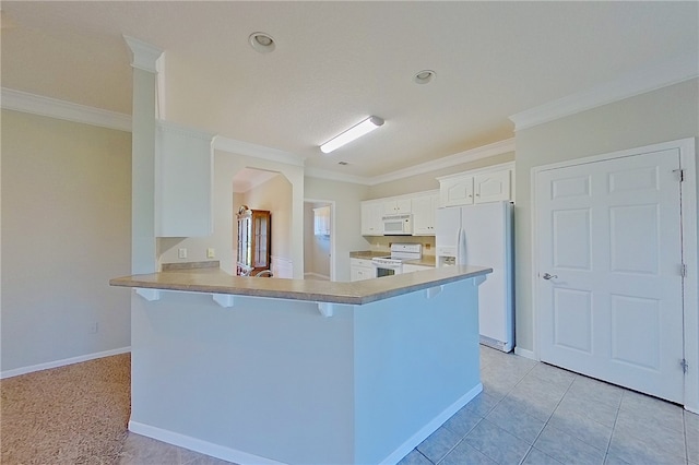 6121 Stoney Brook Dr, Blackshear, GA 31516 - kitchen with white appliances, arched walkways, ornamental molding, white cabinets, and a kitchen bar
