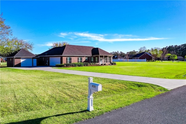 6121 Stoney Brook Dr, Blackshear, GA 31516 - ranch-style home with concrete driveway, an attached garage, and a front lawn