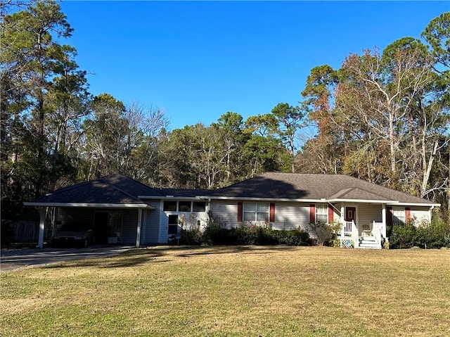 ranch-style home featuring a carport and a front yard