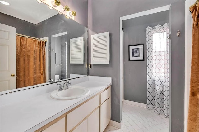 407 Butler Ave, Saint Simons Island, GA 31522 - full bath with vanity, tile patterned floors, a shower with curtain, and baseboards