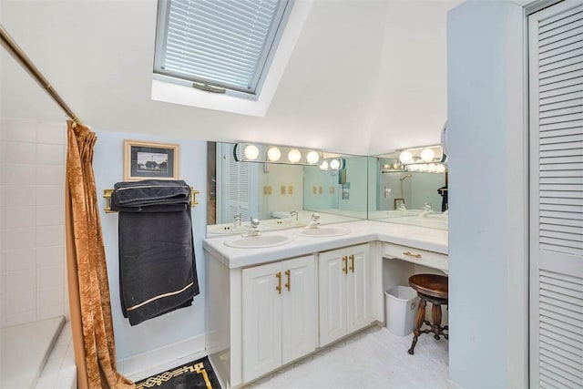 407 Butler Ave, Saint Simons Island, GA 31522 - full bath featuring a skylight, double vanity, and a tile shower