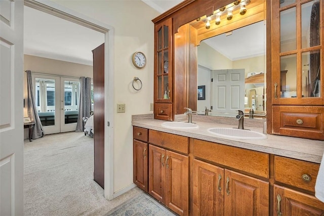 407 Butler Ave, Saint Simons Island, GA 31522 - full bath featuring french doors and double vanity