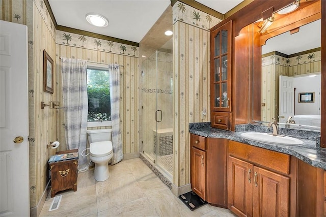407 Butler Ave, Saint Simons Island, GA 31522 - full bathroom with vanity, wallpapered walls, a shower stall, and toilet