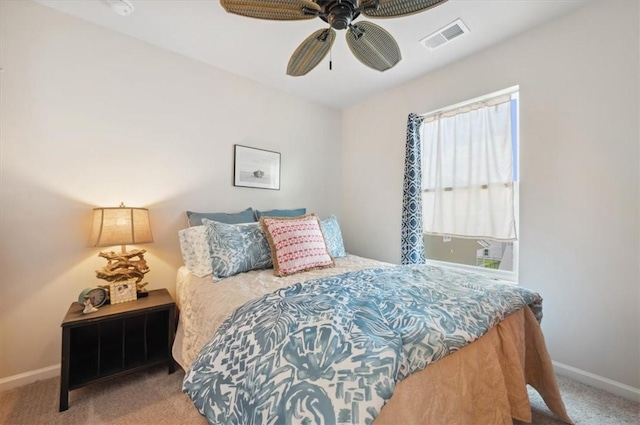 102 Cathead Ln, Darien, GA 31305 - carpeted bedroom with ceiling fan, baseboards, and visible vents