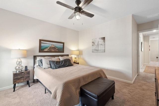 102 Cathead Ln, Darien, GA 31305 - bedroom featuring baseboards, light carpet, and ceiling fan