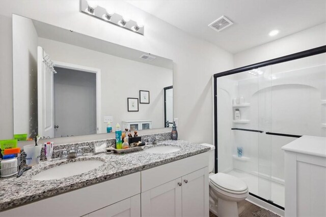 102 Cathead Ln, Darien, GA 31305 - full bath with toilet, visible vents, a shower stall, and a sink
