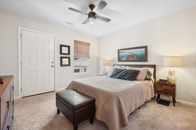 102 Cathead Ln, Darien, GA 31305 - bedroom with light colored carpet, visible vents, baseboards, and a ceiling fan