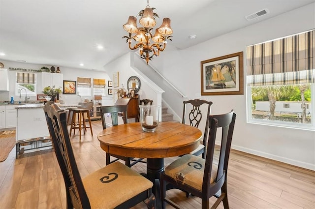 102 Cathead Ln, Darien, GA 31305 - dining space featuring stairway, light wood-style flooring, visible vents, and recessed lighting