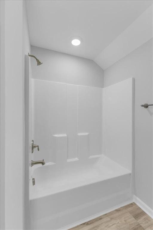 1329 New Castle St, Savannah, GA 31415 - full bath featuring  shower combination, wood finished floors, vaulted ceiling, and baseboards