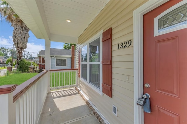 1329 New Castle St, Savannah, GA 31415 - property entrance with covered porch and a lawn