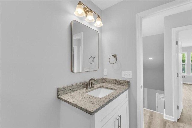 1329 New Castle St, Savannah, GA 31415 - bathroom with wood finished floors, vanity, and baseboards