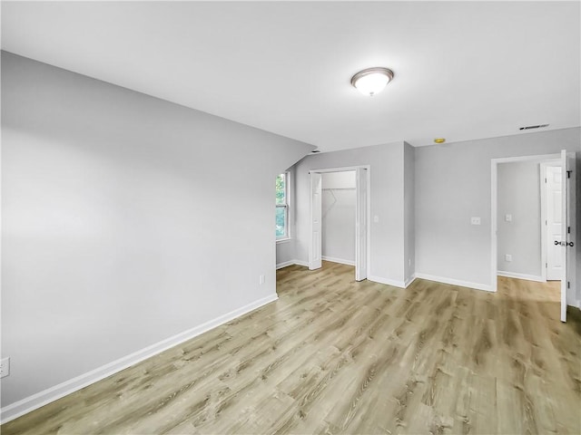 unfurnished living room featuring light hardwood / wood-style flooring