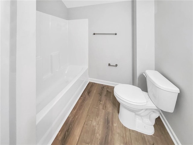 bathroom with wood-type flooring and toilet