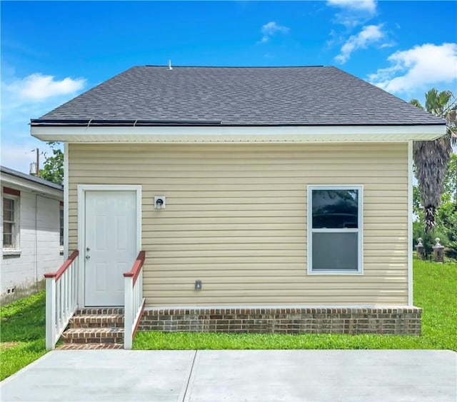 1329 New Castle St, Savannah, GA 31415 - back of house featuring a shingled roof, entry steps, and a patio