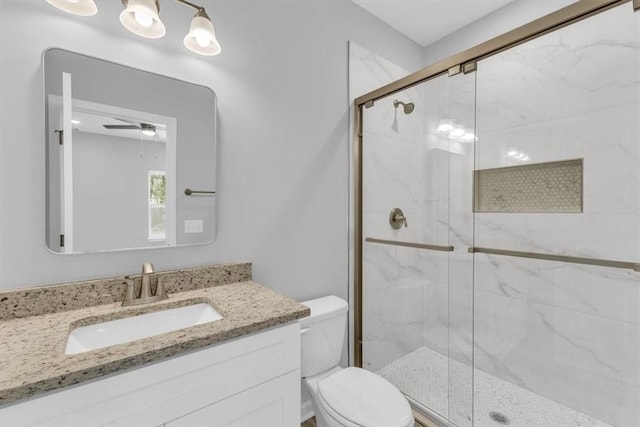 1329 New Castle St, Savannah, GA 31415 - full bath with toilet, vanity, a marble finish shower, and a ceiling fan