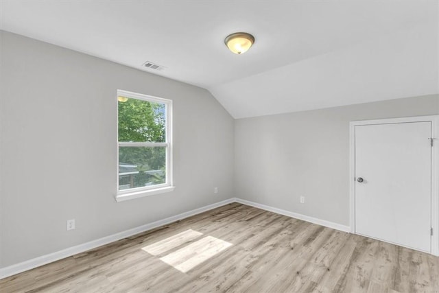 1329 New Castle St, Savannah, GA 31415 - bonus room with light wood finished floors, vaulted ceiling, and baseboards
