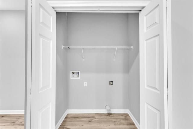 1329 New Castle St, Savannah, GA 31415 - laundry room with washer hookup, wood finished floors, and baseboards