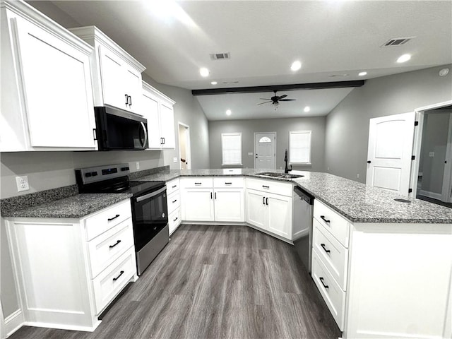 1029 N Church St, Odum, GA 31555 - kitchen with stainless steel appliances, a sink, a ceiling fan, dark wood finished floors, and white cabinets