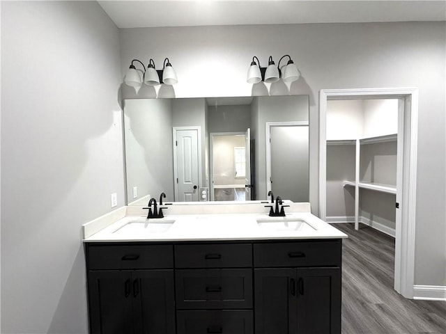 1029 N Church St, Odum, GA 31555 - full bathroom featuring double vanity, a closet, wood finished floors, and baseboards