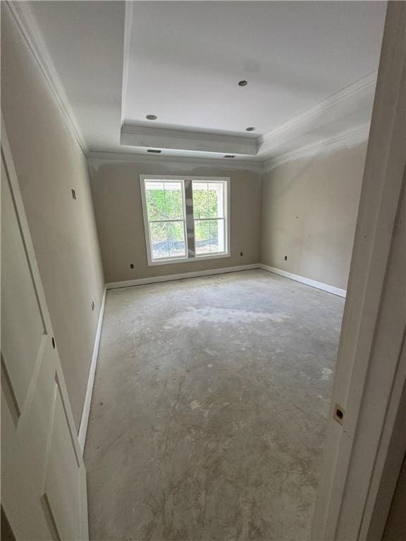 102 Bluebird Ct, Saint Marys, GA 31558 - spare room featuring ornamental molding, a tray ceiling, and baseboards