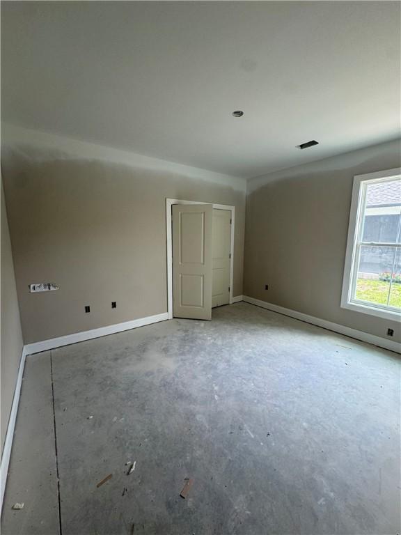 102 Bluebird Ct, Saint Marys, GA 31558 - spare room featuring concrete flooring and baseboards