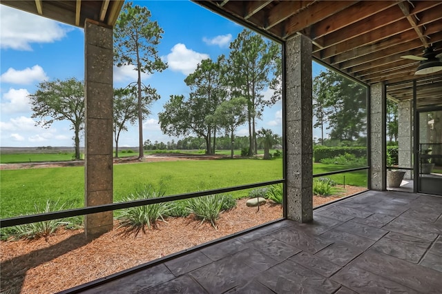 unfurnished sunroom with a rural view