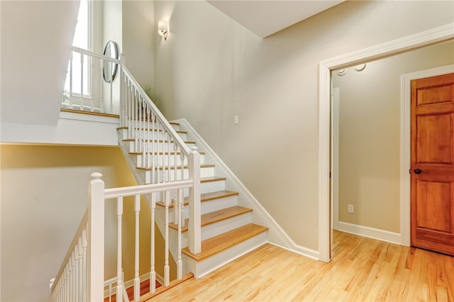 stairs with wood-type flooring