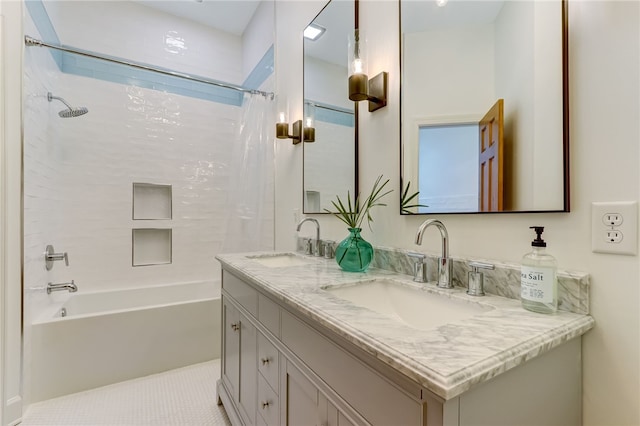 bathroom featuring tile patterned floors, vanity, and shower / tub combo