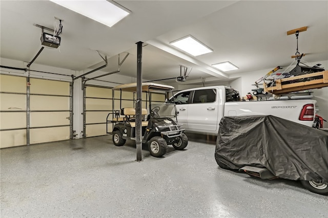 garage featuring a garage door opener