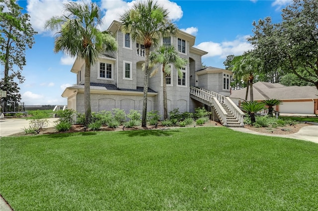 view of front of house featuring a garage and a front yard