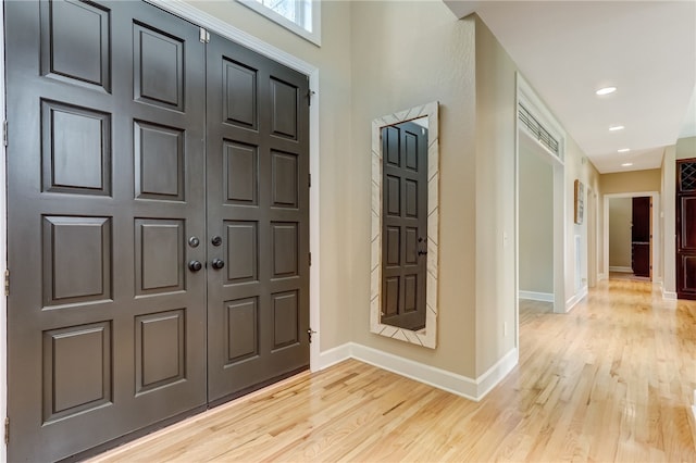 entryway with light hardwood / wood-style flooring