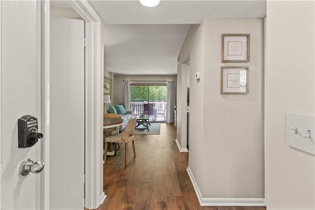 hallway featuring dark hardwood / wood-style floors