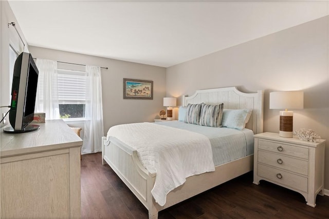 bedroom featuring dark wood-type flooring