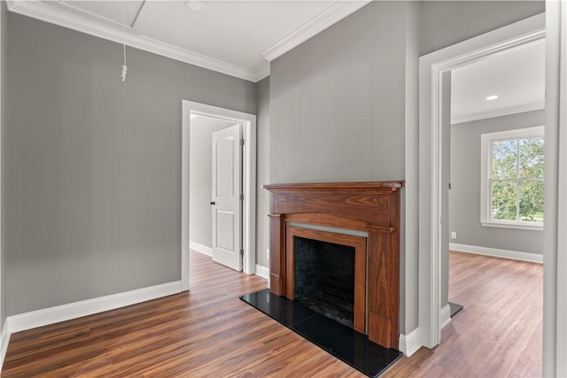 unfurnished living room with ornamental molding and dark wood-type flooring